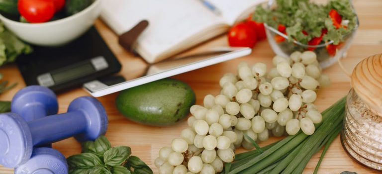 A vibrant composition of fruits, vegetables, and fitness items promoting a healthy lifestyle.